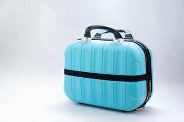 Small blue travel bag with handle, large cloth baggage case. Modern suitcases for traveling....