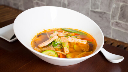 Soup with shrimps and salmon in a traditional restaurant in Japan.