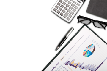 Office analysis chart or graph, pen, eyeglass and calculator. Working desk table concept.