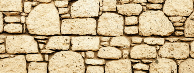 Pattern of old stone wall, surfaced backdrop. Sepia Effect Toned Photo