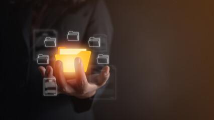 hand holding online documentation database, Document Management System (DMS), online documentation database and process automation to efficiently manage files, Corporate business technology.