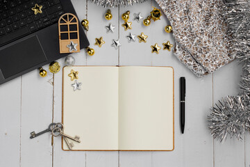 New Year Mockup with notebook, pen, door, clothes, decoration and open book with space for writing. Mockup design. Top view. Wish or goal house concept background.
