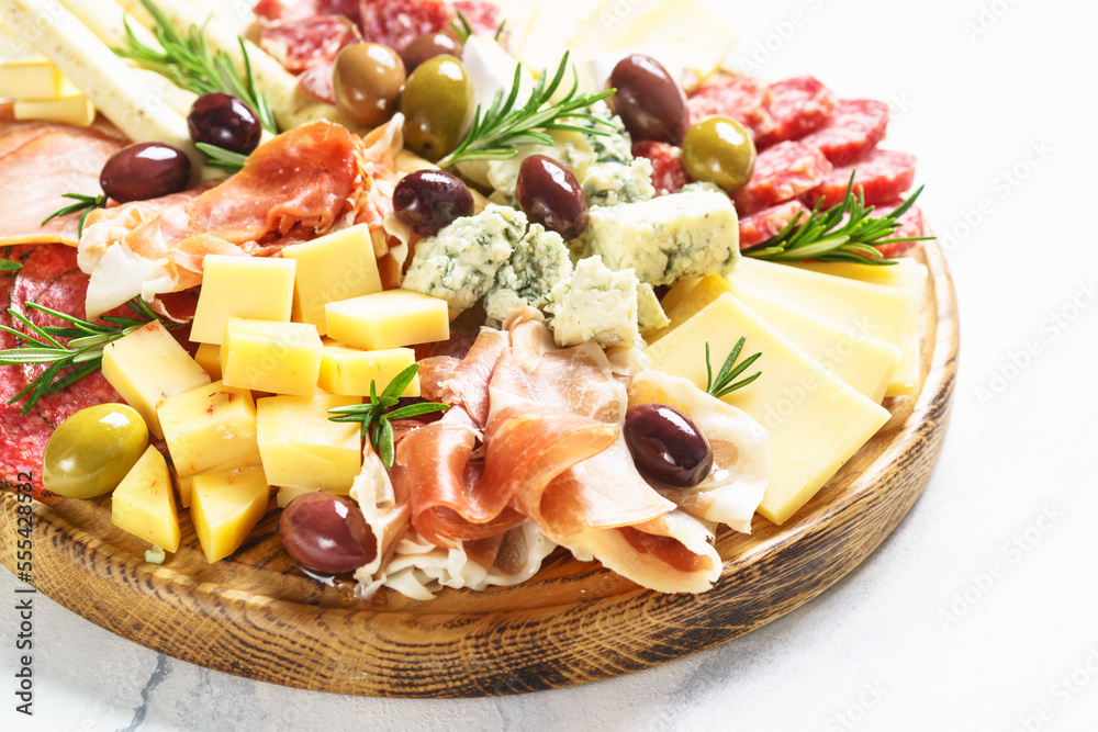 Sticker antipasto platter with jamon, salammi and cheese assortment.