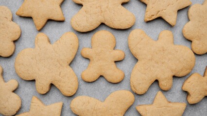 Fototapeta na wymiar Christmas cookies. Gingerbread cookies in a plate top view. Festive gingerbread for Christmas