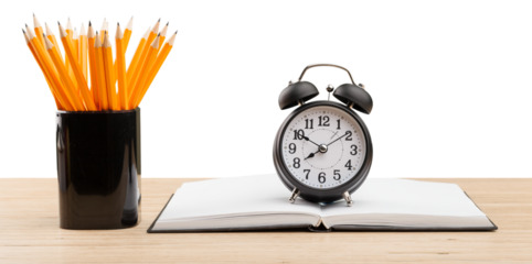 Open books with colored pencil on the desk