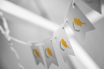 A garland of Cyprus national flags on an abstract blurred background