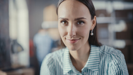 Portrait of a Successful Small Business Owner Smiling, Looking at Camera. Empowering Attractive Caucasian Female in a Warehouse Storeroom with Orders Ready for Shipment.