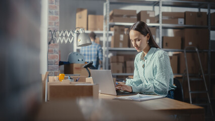 Online Store Inventory Manager Using Laptop Computer, Preparing a Small Parcel for Postage. Young Confident Small Business Owner Working in Storeroom, Preparing Order for Client.
