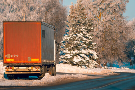 Rear View Of Cargo Car In Winter Parked On The Side Of The Road