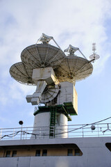Radar dishes are located deck ship.
