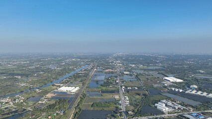 flying above small city insudtry with rive line