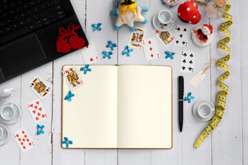 Alice in the wonderland Mockup with notebook, pen, decoration and open book with space for writing....