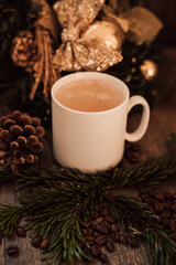 Christmas composition angel, cup of coffee on a dark wooden table