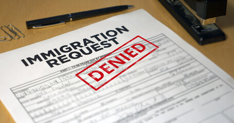 A closeup view of an immigration application getting denied. Data on form is fictional.	 - obrazy, fototapety, plakaty