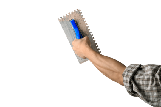 Hands of Plasterer at work. Application of the plaster on the wall