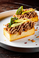 brioche with foie gras on plate