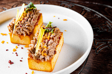 brioche with foie gras on plate