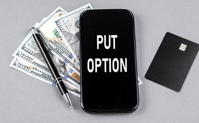 Credit card and text PUT OPTION on smartphone with dollars and pen. Business concept