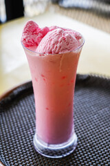 Strawberry protein shake, Fresh Milkshake topped with strawberry ice cream, A glass of strawberry smoothie.
