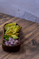 avocado, onion and cilantro, to accompany meat in its juice, typical mexican food