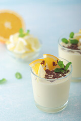 Orange lemon citrus milk mousse in glasses	