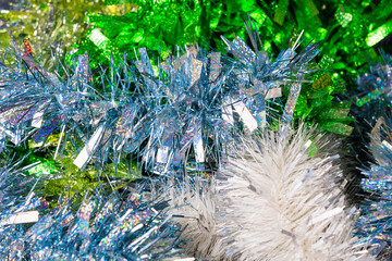 Tinsel for decoration. Preparation for the holidays. Background with selective focus