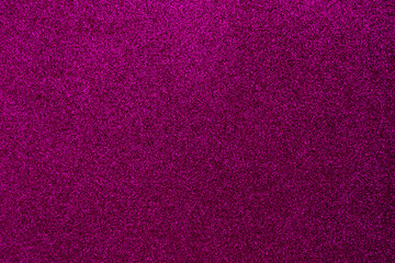 Background with sparkles. Backdrop with glitter. Shiny textured surface. Dark pink
