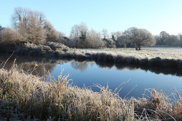 Winter reflections on the River Wey on a cold and frosty day.