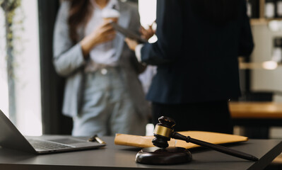 Male lawyer working with contract papers and wooden gavel on tabel in courtroom. justice and law ,attorney, court judge, concept.