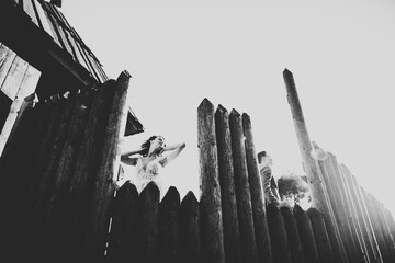Beautiful romantic wedding couple of newlyweds hugging near old castle
