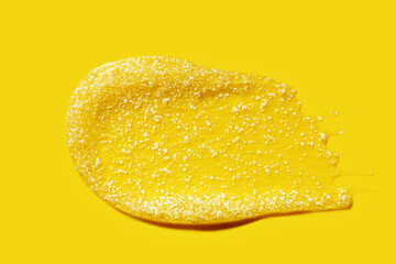 yellow smear of shower scrub\peeling with bubbles and white particles, cosmetic textures, skincare product swatch