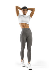 Confident fit young caucasian fitness woman full-length portrait. Muscular fit girl trainer in sportswear, holds her hands behind head