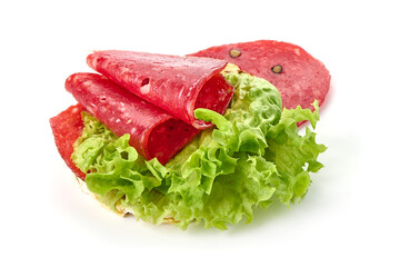 Spanish salchichon sausage, isolated on white background.