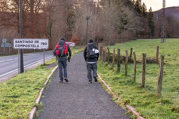 Way of St. James. Two pilgrims starting the Roncesvalles-Zubiri stage