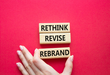 Rethink Revise Rebrand symbol. Wooden blocks with words Rethink Revise Rebrand. Beautiful red...