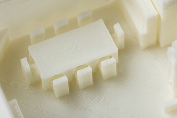 Macro detail of kitchen table and chairs 3D model printed on 3D printer with FDM technology for architectural use.
