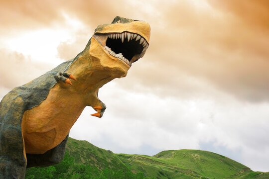 Dinosaur Statue In A Field