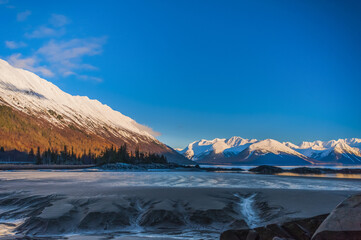 The out-going tide in Turnagain Arm on a sunny, winter day; Alaska, United States fo America