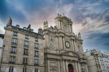 Fototapeta na wymiar Paris, the Saint-Paul church in the Marais, rue Saint-Antoine, with ancient buildings 