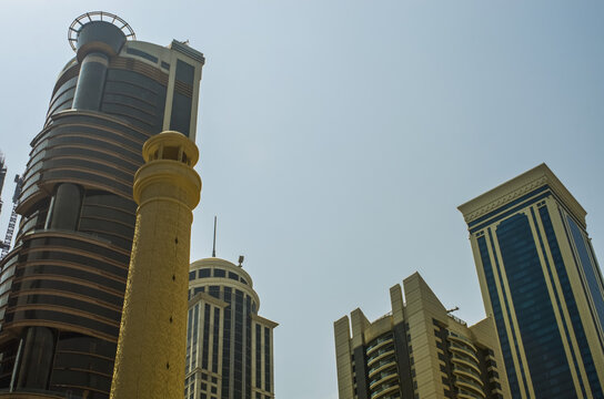 Modern skyscrapers with minaret in the foreground; Doha, Qatar