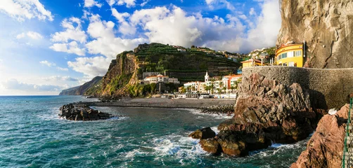 Behangcirkel Madeira island vacation - picturesque village Ponta do Sol with impressive rocks, nice beach and colorful houses. Portugal © Freesurf