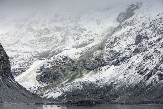 Grey avalanche trace on a snowy mountain slope at Mount Cook National Park, Hooker Valley Track; South Island, New Zealand