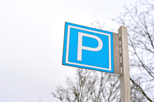Parking sign, parking zone. Park sign at outdoor parking lot against sky