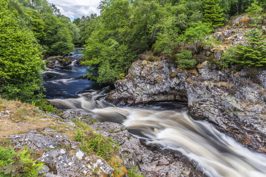 The Falls of Shin is a waterfall on the River Shin in Northern Scotland, famous for salmon leaping upstream; Lairg, Sutherland, Scotland