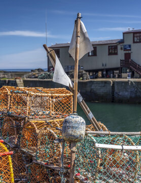 Lobster pots at St. Abbs, a small fishing village on the South-eastern coast of Scotland; St. Abbe, Berwickshire, Scotland