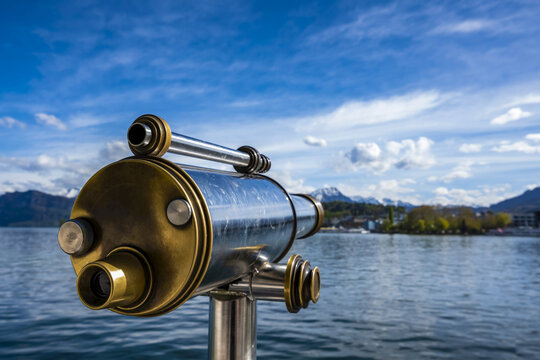 Binoculars looking out to water of Lake Lucerne and shoreline; Lucerne, Lucerne, Switzerland