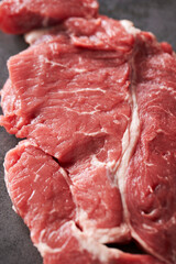raw meat on a dark background