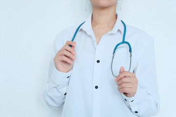 Image of confident female doctor wearing glasses, trainee with stethoscope and medical gown, arms crossed like a professional looking at camera confidently, against white background