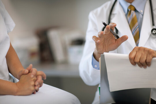 Senior doctor consulting with a patient after a medical exam