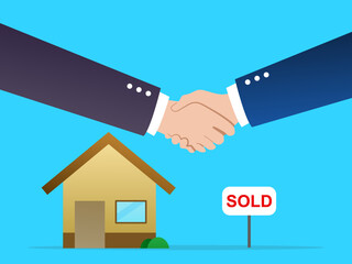 Two people who shake their hands as a sign that they have made a deal to buy and sell a house or apartment